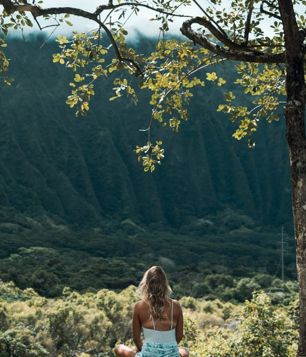 Woman in a serene yoga pose, embodying peace and balance.